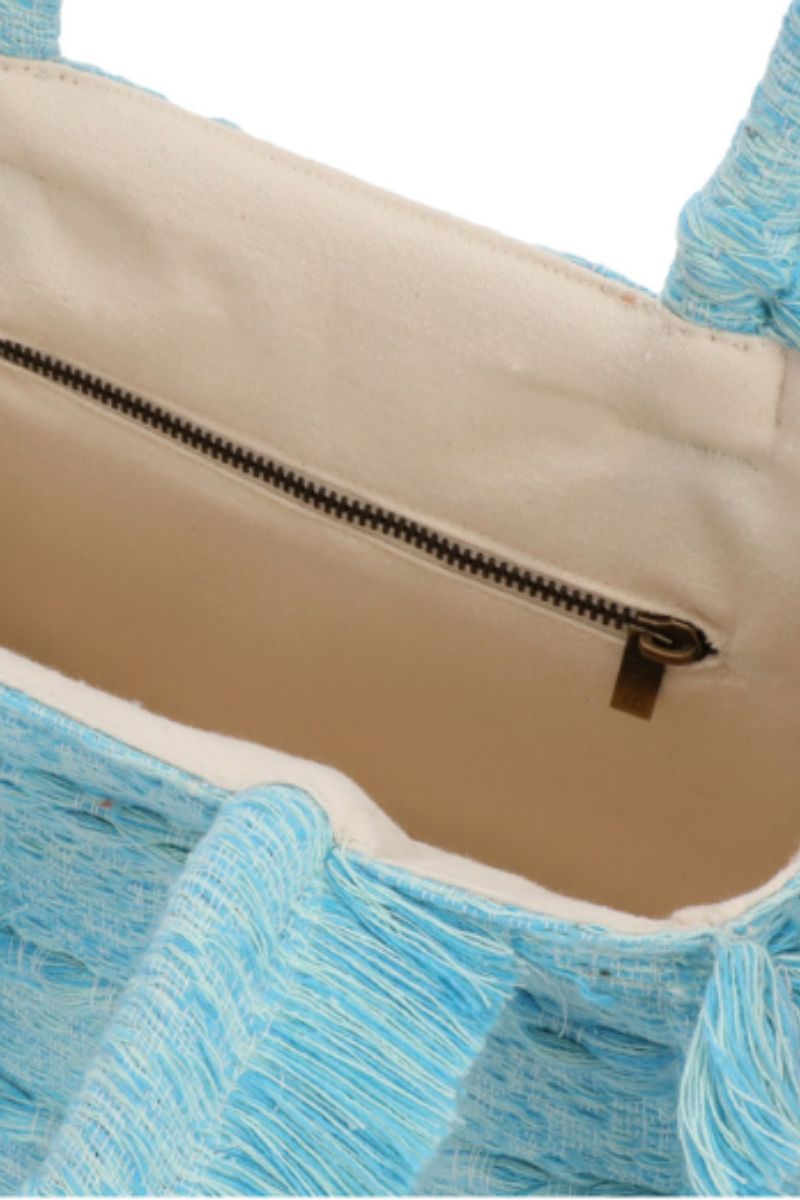 Medium Bani Poka Bali top handle bag with a woven design and structured silhouette, featuring a sturdy top handle and elegant craftsmanship.