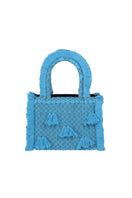 Medium Bani Poka Bluenzo top handle bag with structured design and sleek handles on a neutral background.