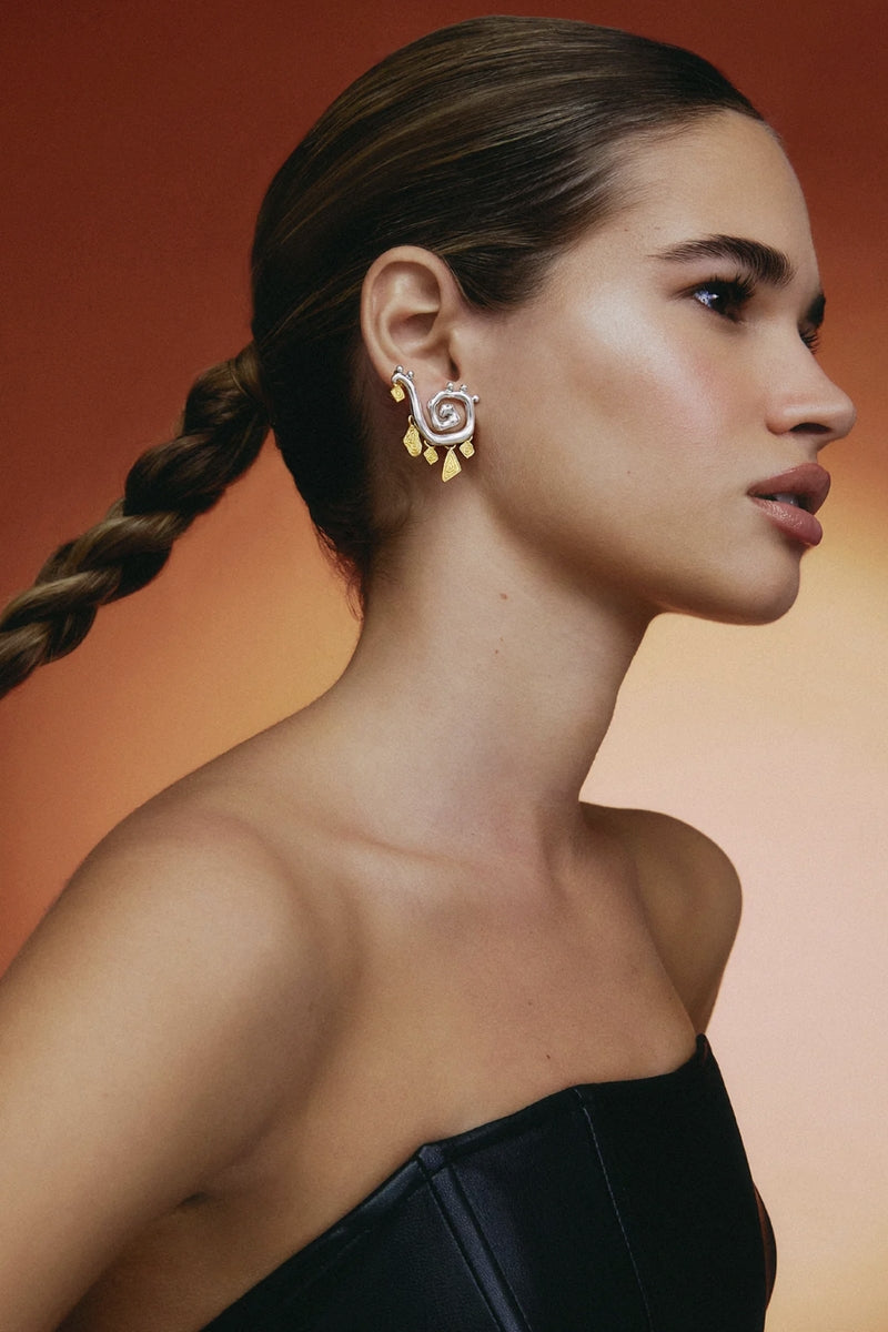 Jude Benhalim Medusa earrings featuring intricate snake and Medusa head design in silver-tone metal.