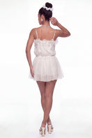 White Melody dress by Nana Jacqueline, a stylish mini dress featuring a feminine design and elegant fit, shown on a model.