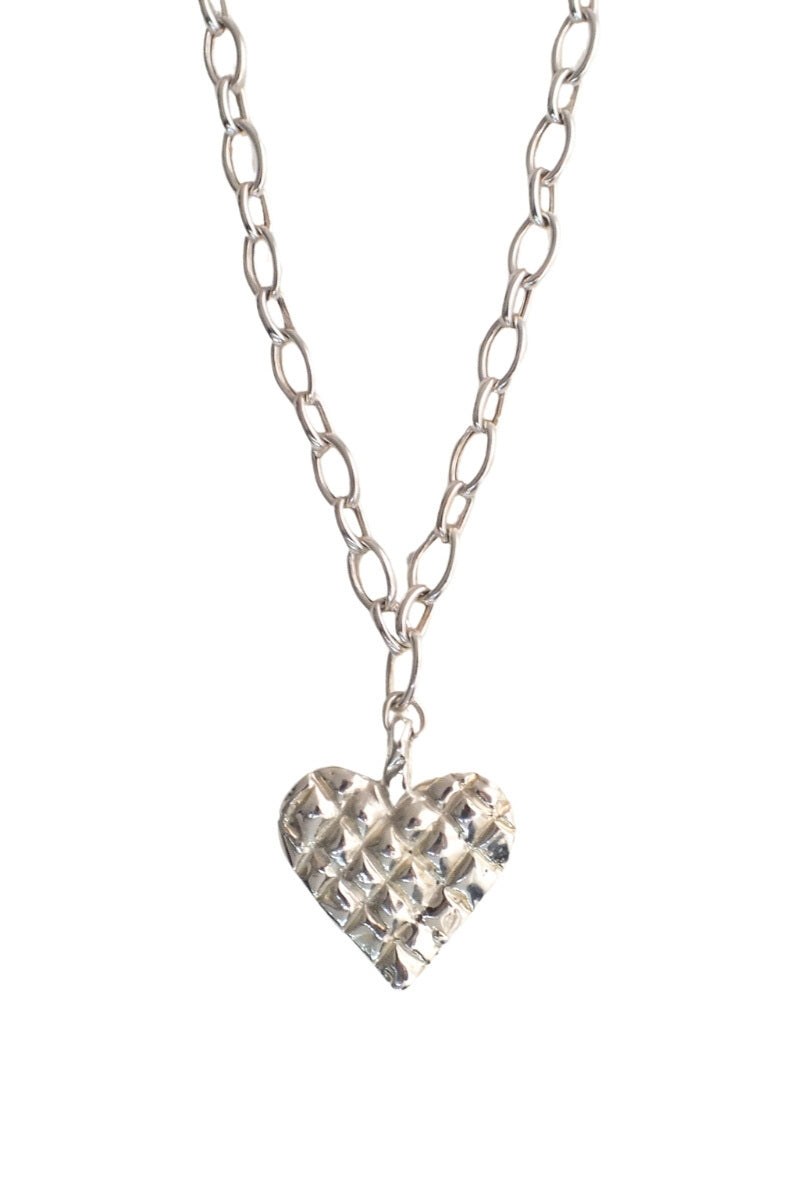 Silver melted heart necklace by Oz Objects featuring a unique, artistic pendant on a delicate chain.