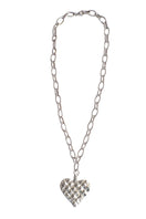 Silver melted heart necklace by Oz Objects featuring a unique, abstract heart pendant on a delicate chain.