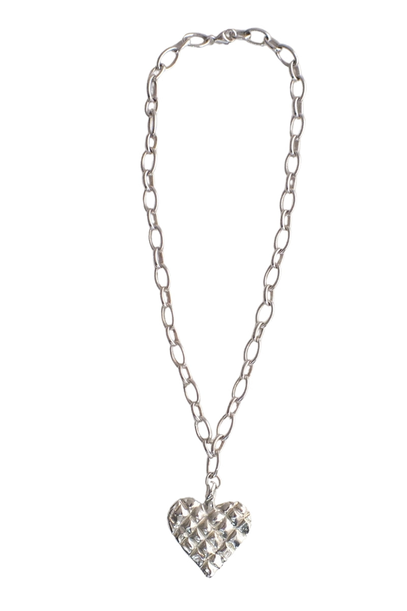 Silver melted heart necklace by Oz Objects featuring a unique, abstract heart pendant on a delicate chain.