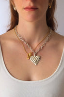 Silver melted heart necklace by Oz Objects featuring a unique, handcrafted melted heart pendant on a delicate chain.