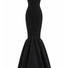 Black Mencia gown by Maylé Vásquez featuring elegant fabric and classic silhouette, perfect for formal occasions.