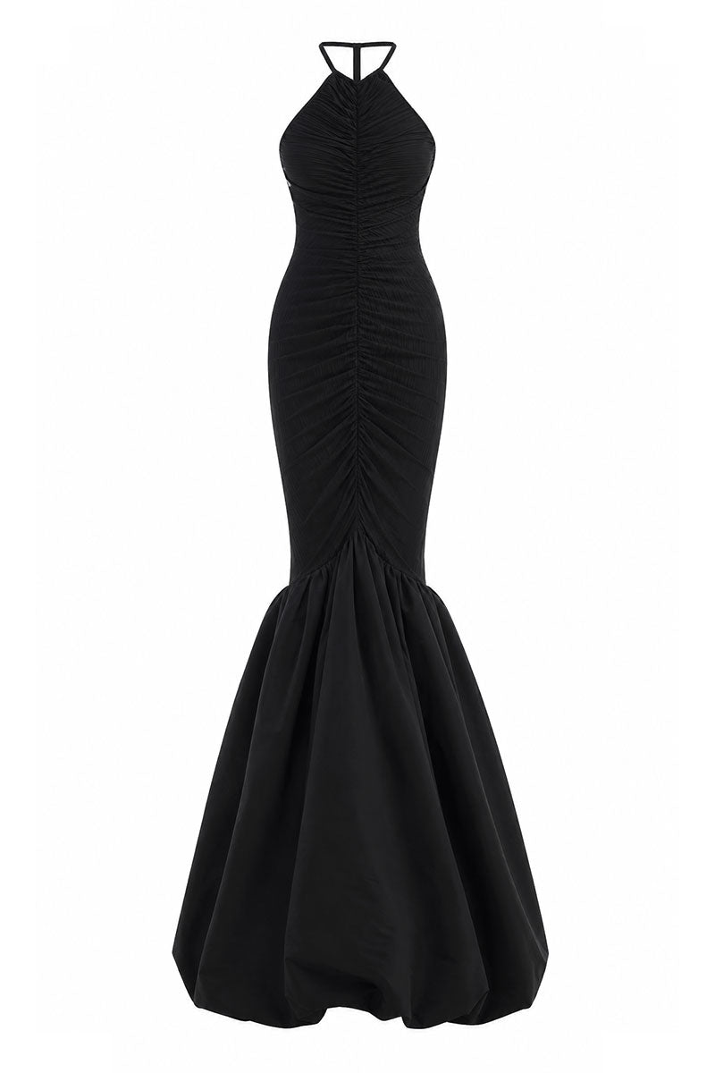 Black Mencia gown by Maylé Vásquez featuring elegant fabric and classic silhouette, perfect for formal occasions.