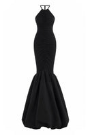 Black Mencia gown by Maylé Vásquez featuring elegant fabric and classic silhouette, perfect for formal occasions.