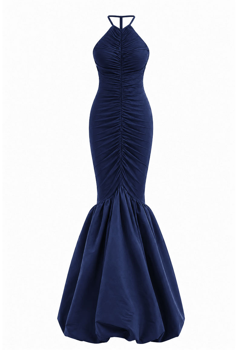 Navy Mencia gown by Maylé Vásquez featuring elegant fabric and a flowing silhouette, perfect for formal occasions.