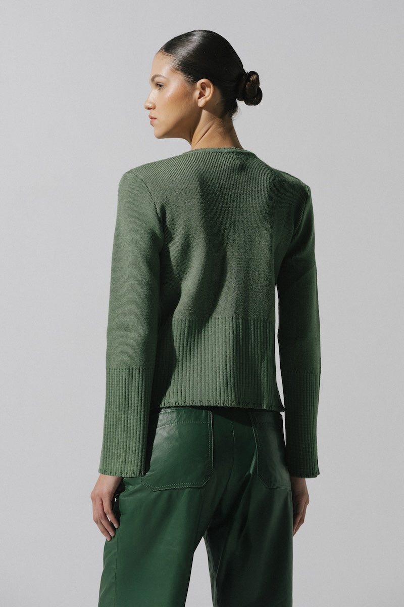 Baobab Meraky sweater in sage green, showcasing its cozy knit texture and relaxed fit, perfect for casual wear.
