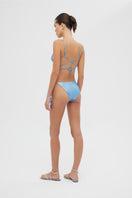 Shiny blue Meri bikini set by Maliluha, featuring a stylish two-piece swimsuit with a halter top and matching bottoms.