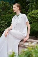 Elegant mermaid evening gown by I.H.F with high neck and gathered waistline, shown in a flowing, form-fitting design.