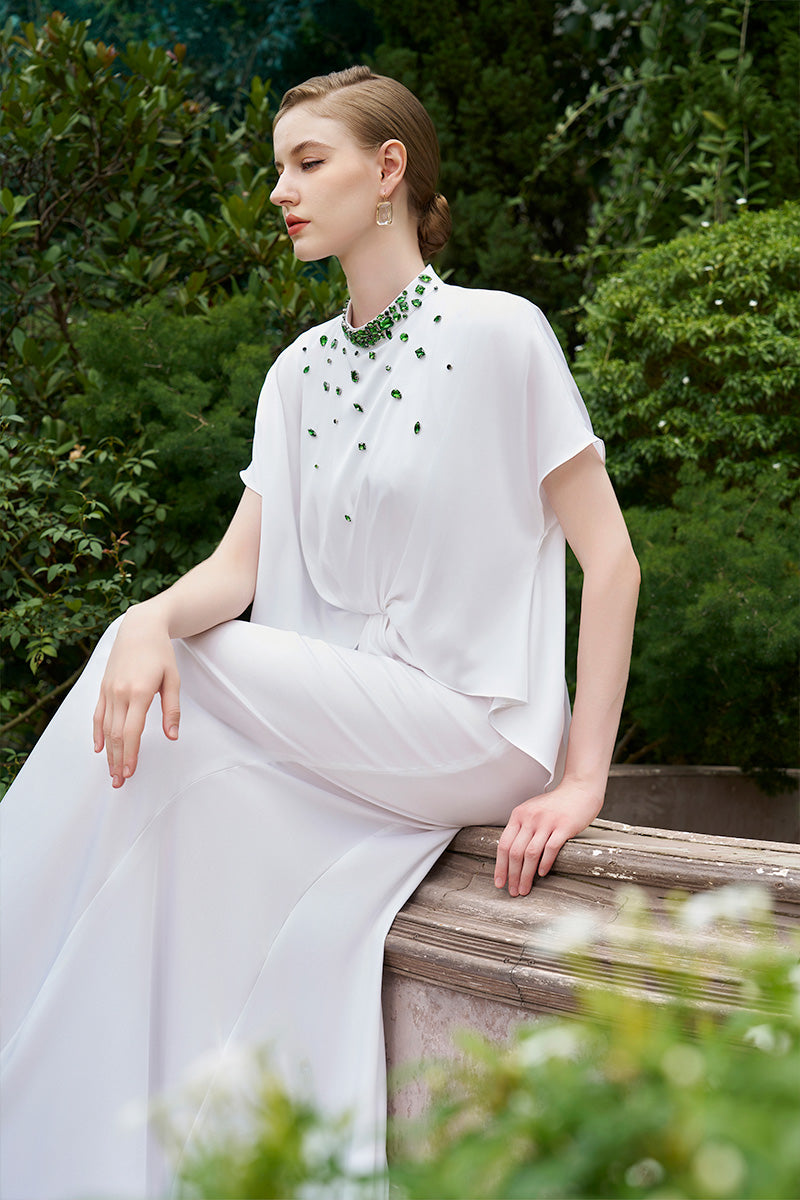 Elegant mermaid evening gown by I.H.F with high neck and gathered waistline, shown in a flowing, form-fitting design.