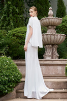 Elegant mermaid evening gown by I.H.F with high neck and gathered waist, featuring a fitted silhouette and flowing fabric.