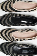 Black mesh ballerina flats with zebra print accents by House of Atana, showcasing stylish and comfortable footwear.