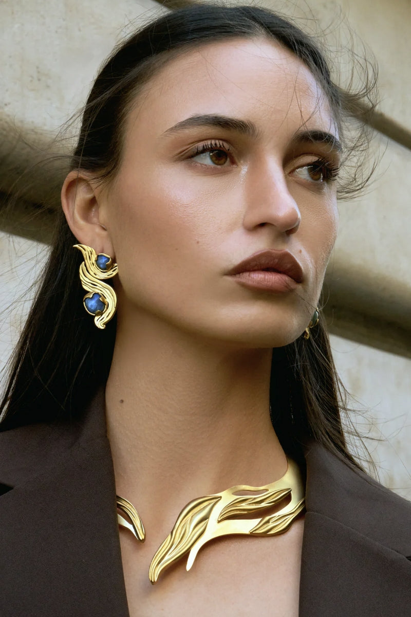 Blue meteorite earrings by Jude Benhalim featuring gold accents, showcasing their unique textured meteorite stone design.