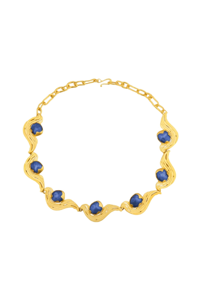Blue meteorite pendant necklace by Jude Benhalim featuring a gold chain, showcasing a striking celestial-inspired design.