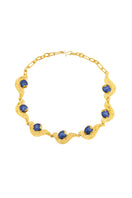 Blue meteorite pendant necklace by Jude Benhalim featuring a gold chain, showcasing a striking celestial-inspired design.