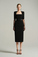 Black knee-length midi dress by I.H.F Studio with trapezium neckline and dark green crystal-embellished bow belt.
