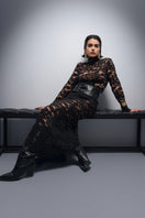 Black Nana Gotti Midnight in Manhattan maxi dress displayed on hanger with flowing fabric and elegant design.