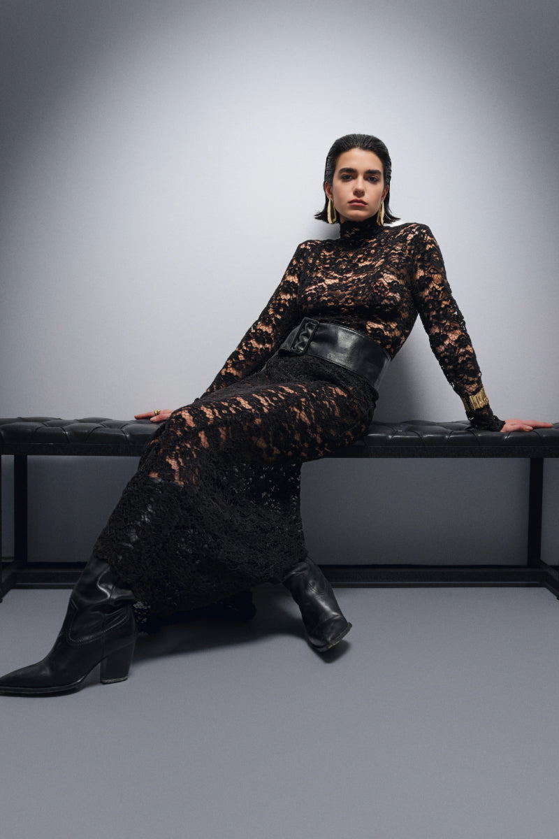 Black Nana Gotti Midnight in Manhattan maxi dress displayed on hanger with flowing fabric and elegant design.