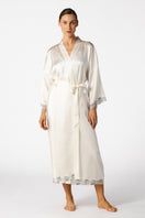 Ivory silk bridal robe by NK IMODE featuring long, elegant design with delicate lace accents and flowing fabric.