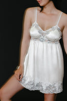 Ivory silk bridal babydoll chemise by NK IMODE featuring delicate lace details and a flowing, elegant nightgown style.