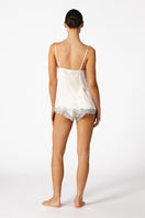 Ivory silk lingerie set by NK IMODE featuring a delicate camisole and matching shorts, designed for elegant bridal sleepwear.