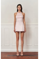 Light pink mini bow dress from Stolen Stores, stylish mini dress with a cute bow detail, perfect for casual or special occasions.