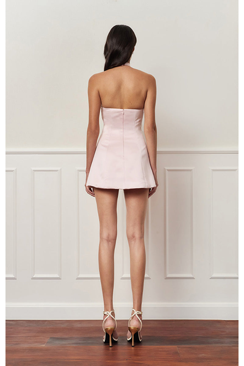Light pink mini bow dress by Stolen Stores, featuring a stylish mini dress design perfect for casual or semi-formal wear.