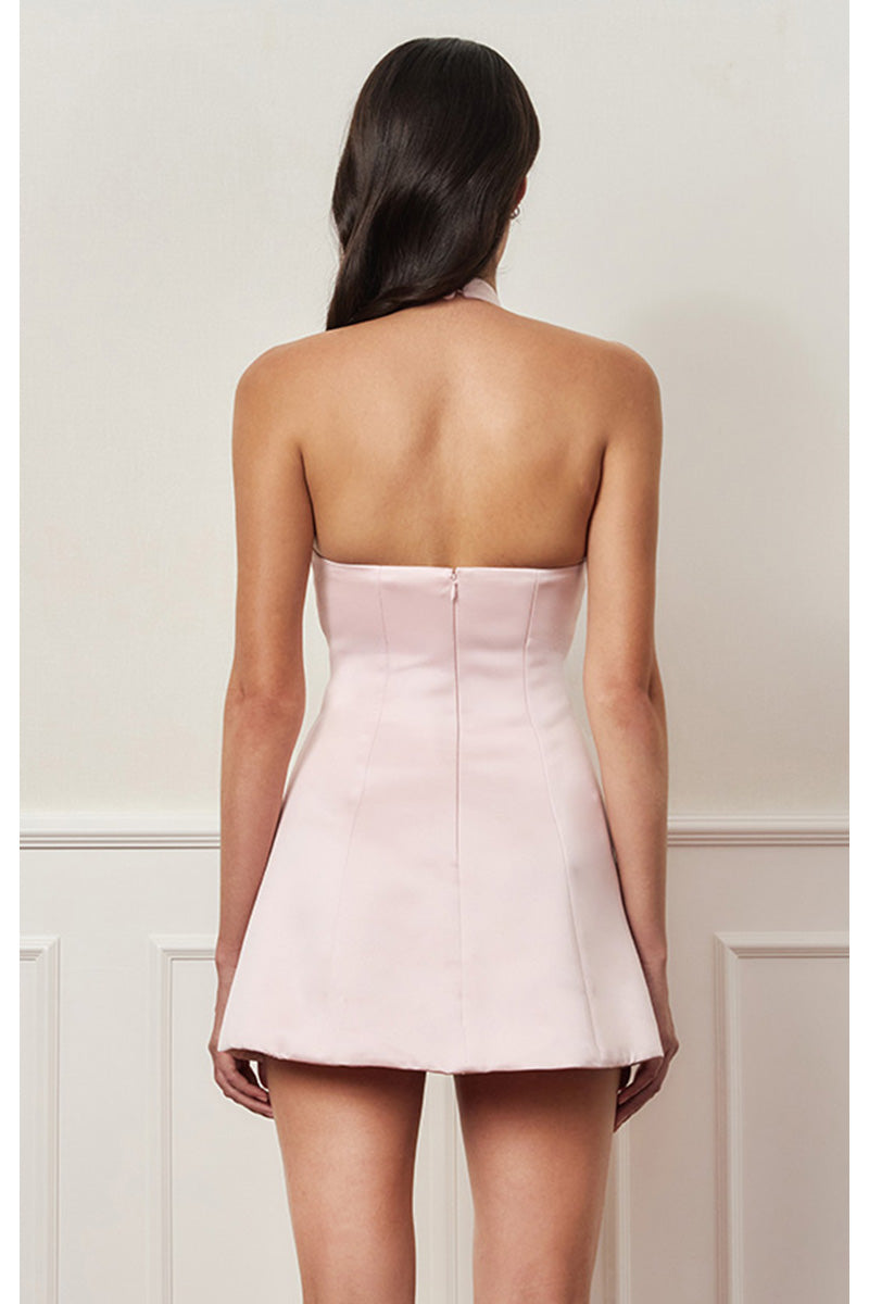 Light pink mini bow dress from Stolen Stores, featuring a stylish mini dress design with bow details on the front.