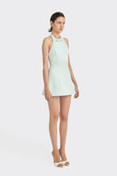 Light blue CULT MIA X Stolen Stores bow mini dress displayed on a hanger with a close-up of the bow detail.