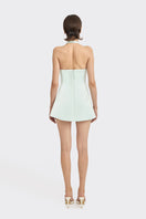 Light blue Cult Mia X Stolen Stores bow mini dress displayed on a mannequin, showcasing its stylish design and fit.