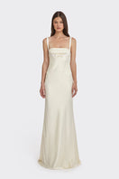 Light yellow mini bow maxi dress by Stolen Stores, flowing fabric and stylish design perfect for summer or casual occasions.