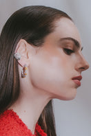 Mini pebble gold and silver earrings by Jude Benhalim, featuring small rounded shapes in metal, displayed on a white background.