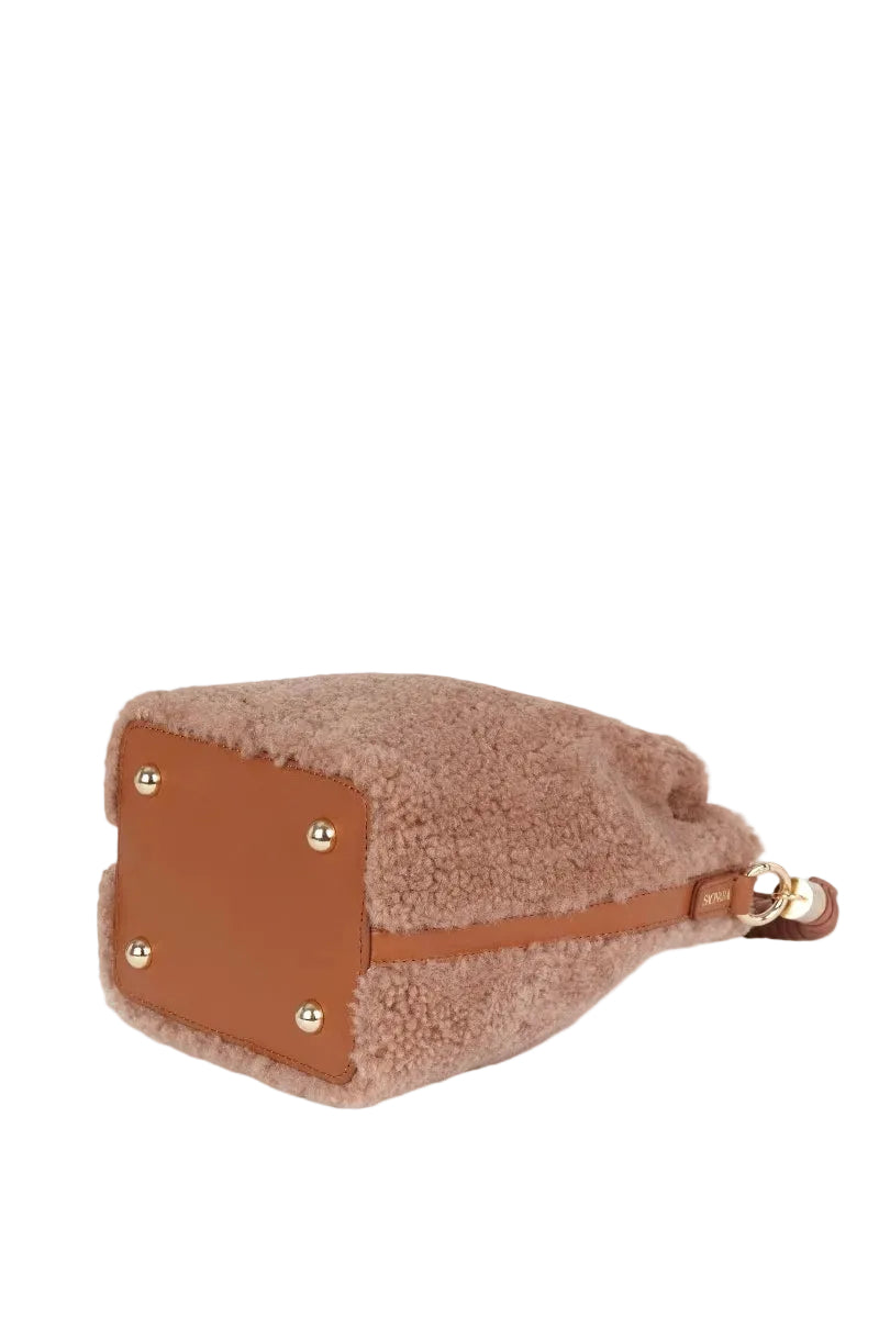Saonara mini bucket bag in warm caramel color with top handle, stylish and compact for everyday use.