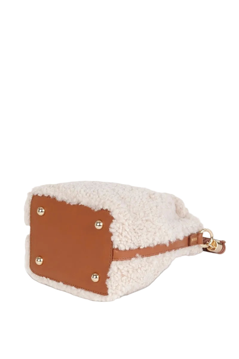 Saonara mini bucket top handle bag in off-white cozy fabric, featuring a compact design and stylish shoulder strap.