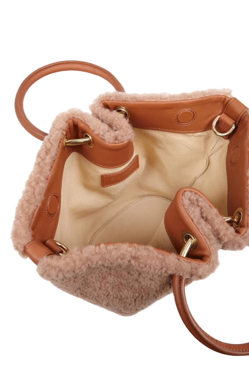Saonara Mini Capazo in caramel cozy, top handle bag with a compact, stylish design and textured surface.