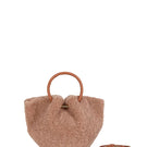 Saonara mini Capazo in caramel color, a cozy top handle bag with woven design and rounded shape.