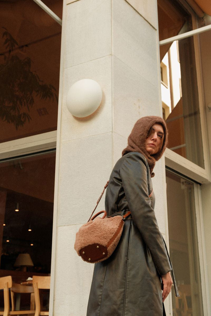 Saonara mini capazo top handle bag in caramel cozy leather, showing its compact, stylish design with sturdy handles.