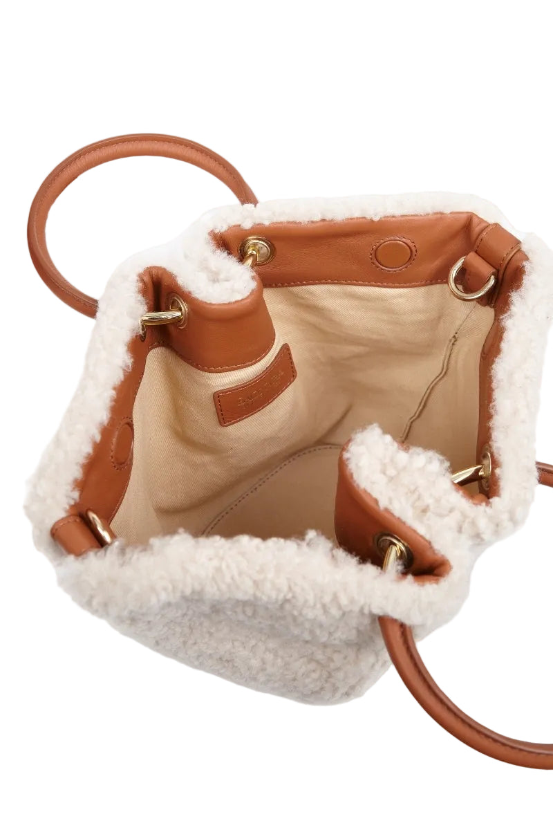 Saonara mini capazo cozy off-white top handle bag with rounded shape and short handle, stylish and compact accessory.