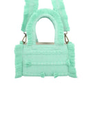 Light blue Bani Mini Poka Aqua top handle bag with a compact design and sturdy handle, perfect for stylish everyday use.