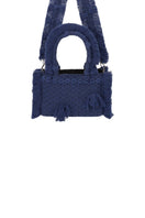 Navy blue Bani Mini Poka top handle bag with a compact design and sleek handle, perfect for stylish everyday use.