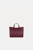 Saonara mini shopping shoulder bag in berry leather with gold-tone hardware and adjustable strap on a plain background.