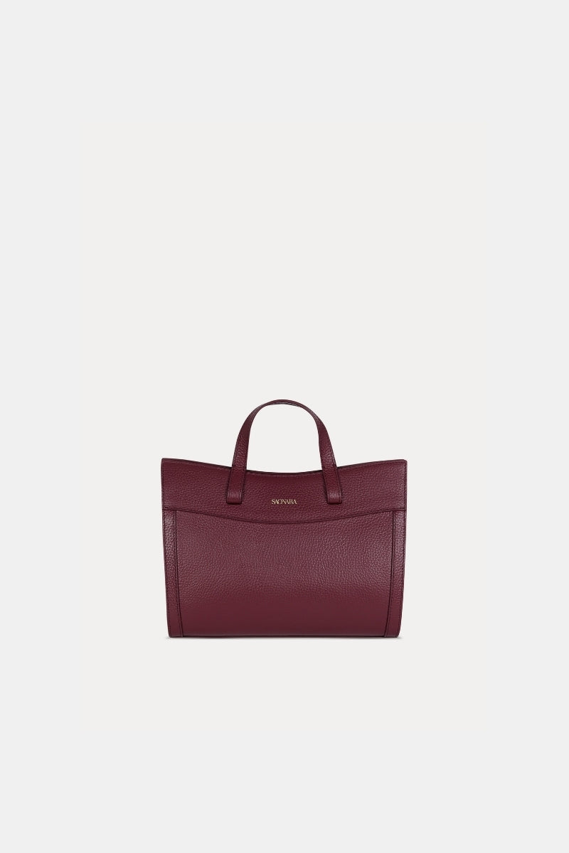 Saonara mini shopping shoulder bag in berry leather with gold-tone hardware and adjustable strap on a plain background.