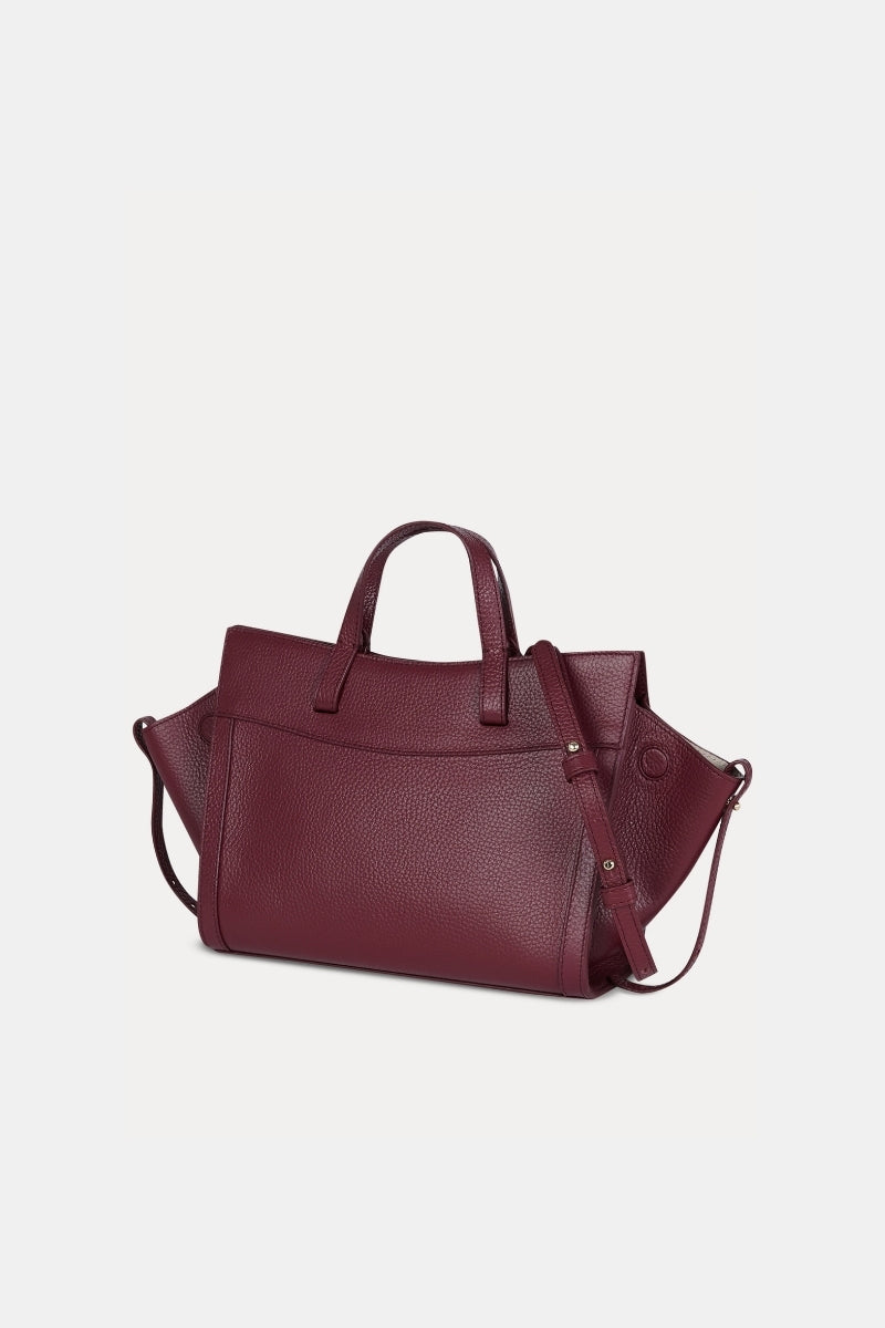 Saonara mini shopping shoulder bag in berry leather with a compact design and top handle, perfect for stylish everyday use.