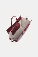 Saonara mini shopping shoulder bag in berry leather with gold-tone hardware and adjustable strap, stylish and compact design.