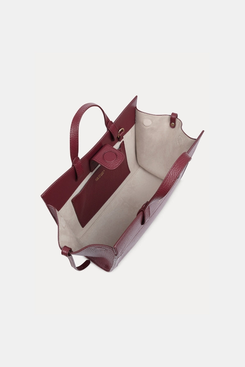 Saonara mini shopping shoulder bag in berry leather with gold-tone hardware and adjustable strap, stylish and compact design.