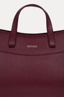 Saonara mini shopping shoulder bag in berry leather with gold-tone hardware and adjustable strap, stylish and compact design.
