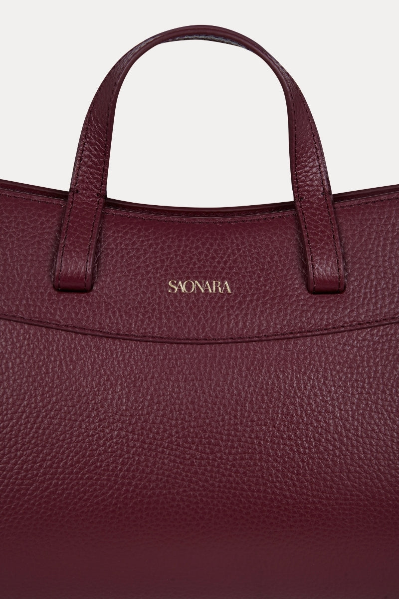 Saonara mini shopping shoulder bag in berry leather with gold-tone hardware and adjustable strap, stylish and compact design.