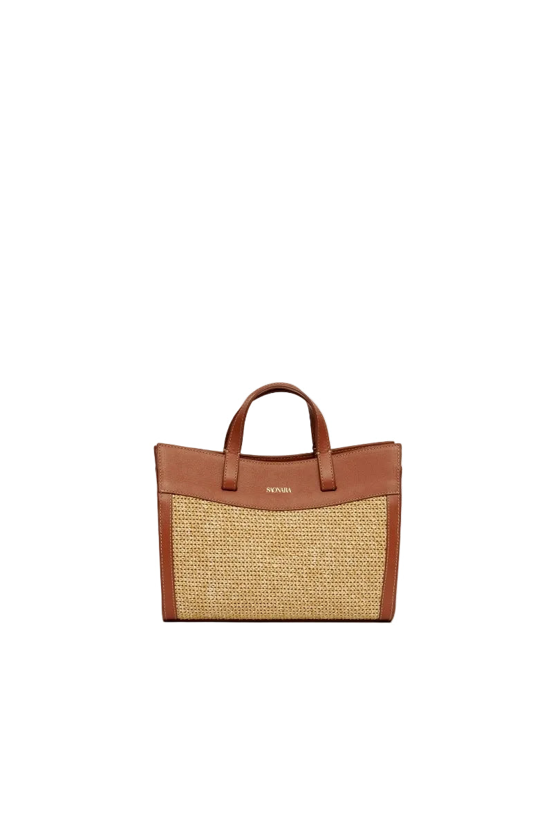 Saonara mini shopping bag with raffia and caramel leather shoulder bag, showing textured raffia surface and leather strap details.